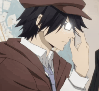 A Man Wearing Glasses And A Hat Is Holding His Hand To His Forehead GIF