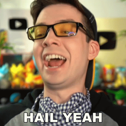 A Man Wearing Glasses And A Hat Is Laughing And Says " Hail Yeah " GIF