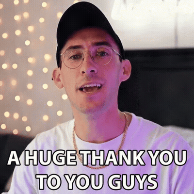 A Man Wearing Glasses And A Hat Is Saying A Huge Thank You To You Guys GIF