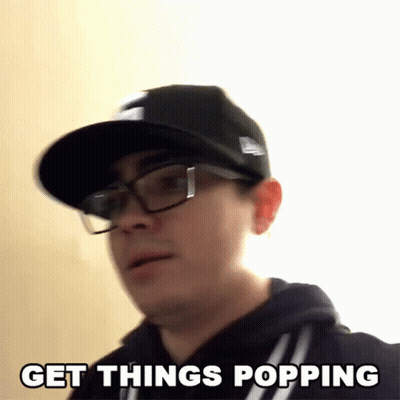 A Man Wearing Glasses And A Hat Is Saying Get Things Popping GIF