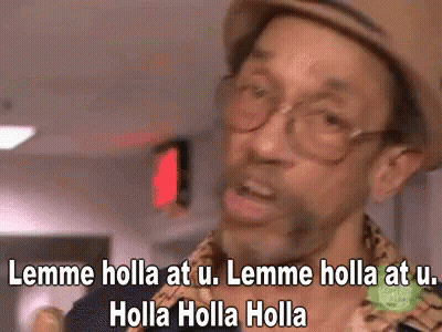 A Man Wearing Glasses And A Hat Is Saying Lemme Holla At U. GIF
