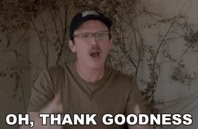 A Man Wearing Glasses And A Hat Is Saying Oh Thank Goodness GIF