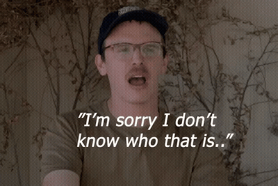 A Man Wearing Glasses And A Hat Says I 'M Sorry I Don 'T Know Who That Is GIF