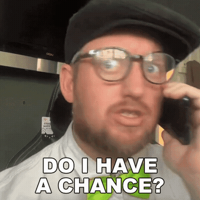 A Man Wearing Glasses And A Hat Talking On A Cell Phone With The Words Do I Have A Chance Below Him GIF