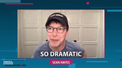 A Man Wearing Glasses And A Hat That Says Lazy Susan On It GIF