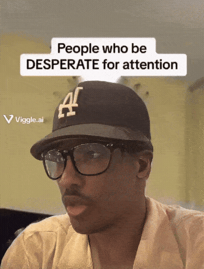 A Man Wearing Glasses And A Hat That Says ' People Who Be Desperate For Attention ' GIF