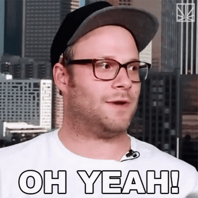 A Man Wearing Glasses And A Hat With The Words Oh Yeah On His Shirt GIF