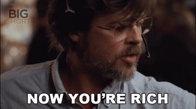 A Man Wearing Glasses And A Headset Says " Now You 'Re Rich " GIF