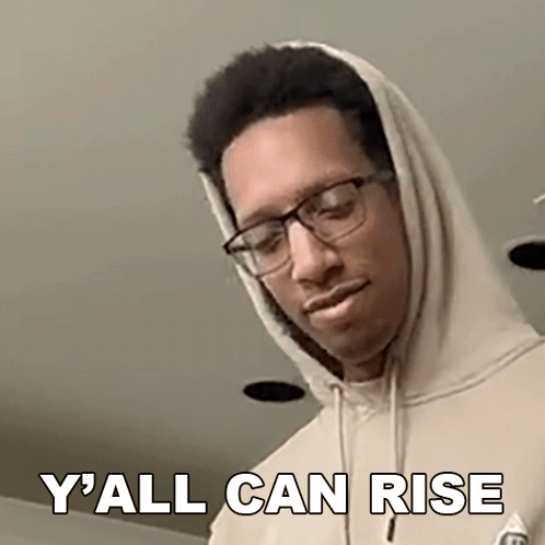 A Man Wearing Glasses And A Hoodie Is Making A Funny Face And Saying `` Y All Can Rise '' . GIF