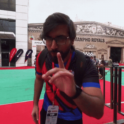 A Man Wearing Glasses And A Lanyard That Says Amd Vip GIF