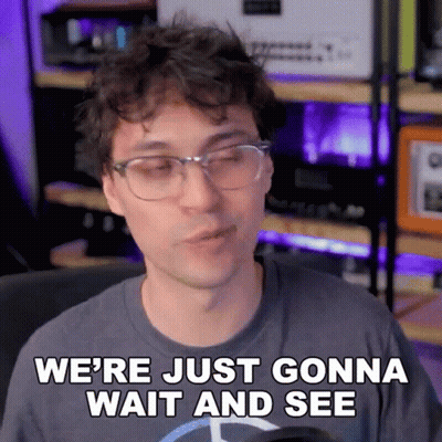 A Man Wearing Glasses And A Mercedes Shirt Says We 'Re Just Gonna Wait And See GIF