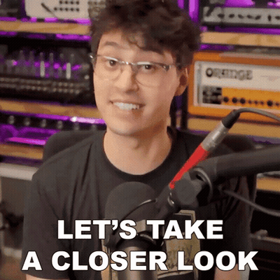 A Man Wearing Glasses And A Microphone Says " Let 'S Take A Closer Look " GIF