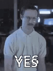 A Man Wearing Glasses And A Mustache Is Giving A Yes Sign . GIF