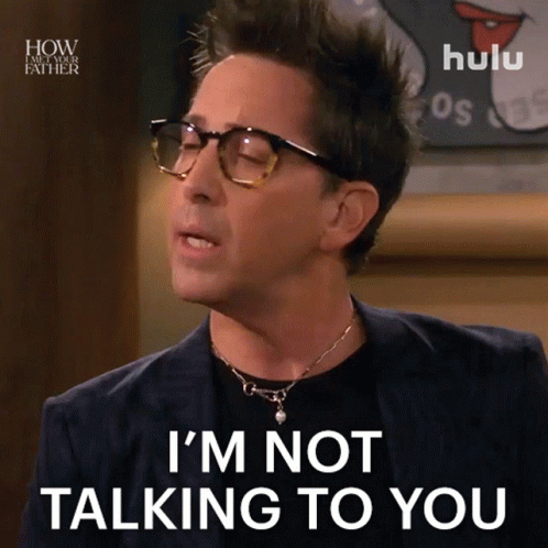 A Man Wearing Glasses And A Necklace Says I 'M Not Talking To You GIF