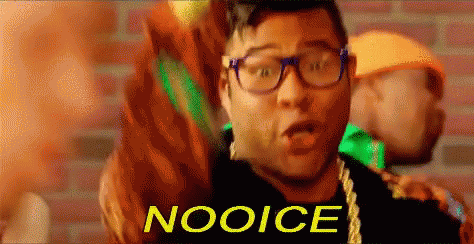 A Man Wearing Glasses And A Necklace With The Word Nooice Written On It GIF