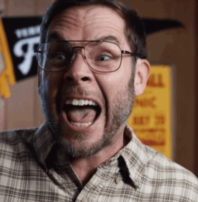 A Man Wearing Glasses And A Plaid Shirt Is Making A Funny Face With His Mouth Open GIF
