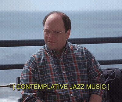 A Man Wearing Glasses And A Plaid Shirt Is Sitting On A Pier And Says Contemplative Jazz Music GIF