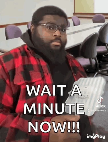 Man In Glasses And Plaid Shirt Waits GIF