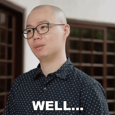 A Man Wearing Glasses And A Polka Dot Shirt Says " Well " GIF