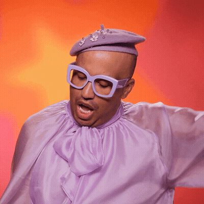 A Man Wearing Glasses And A Purple Shirt With The Word Swish Written On It GIF