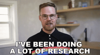 A Man Wearing Glasses And A Rainbow Shirt Says " I 'Ve Been Doing A Lot Of Research " GIF
