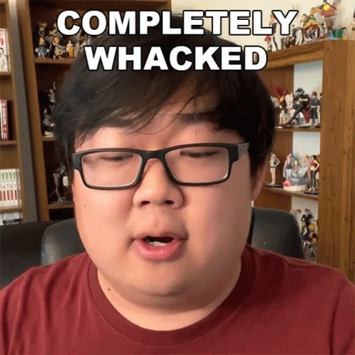 A Man Wearing Glasses And A Red Shirt Says " Completely Whacked " GIF