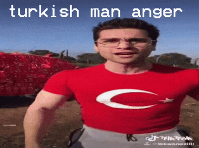 A Man Wearing Glasses And A Red Shirt With A C On It GIF