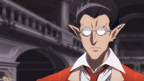 A Man Wearing Glasses And A Red Suit Has The Word Dream Written Below Him GIF