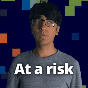 A Man Wearing Glasses And A Shirt That Says At A Risk On It GIF