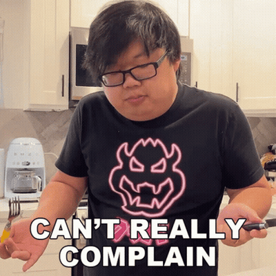 A Man Wearing Glasses And A Shirt That Says Can T Really Complain GIF
