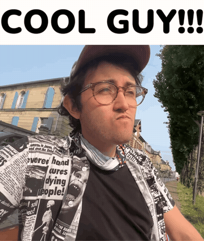 A Man Wearing Glasses And A Shirt That Says Cures Dying People On It GIF