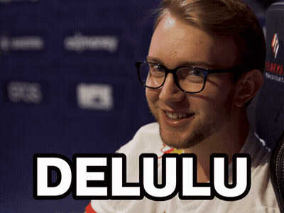 A Man Wearing Glasses And A Shirt That Says Delulu On It GIF