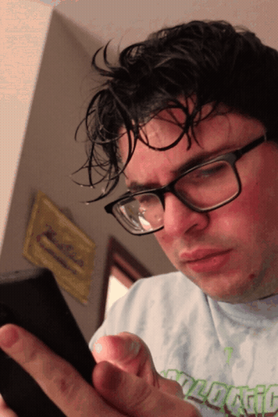 A Man Wearing Glasses And A Shirt That Says " Ecological " GIF