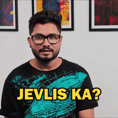 A Man Wearing Glasses And A Shirt That Says Jevlis Ka On It GIF