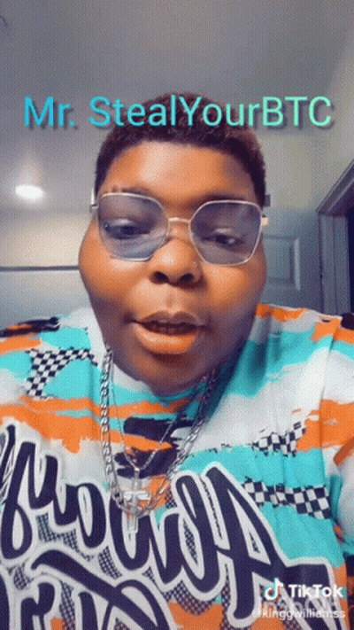 A Man Wearing Glasses And A Shirt That Says " Mr. Steal Your Btc " GIF