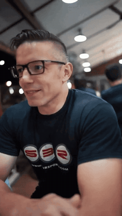A Man Wearing Glasses And A Shirt That Says Sbr On It GIF