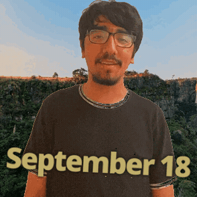 A Man Wearing Glasses And A Shirt That Says September 18 On It GIF