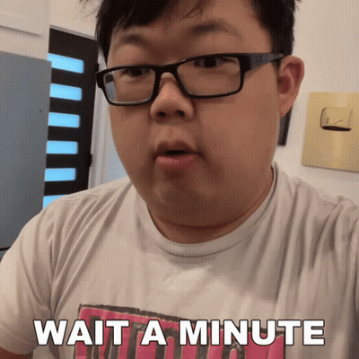 A Man Wearing Glasses And A Shirt That Says Wait A Minute On It GIF