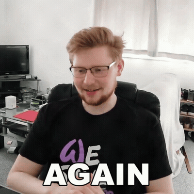 A Man Wearing Glasses And A Shirt That Says " We Again " GIF