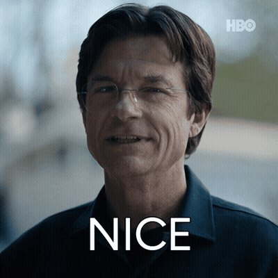 A Man Wearing Glasses And A Shirt With The Word Nice Written On His Face GIF