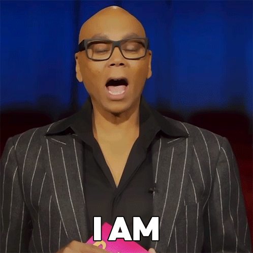 A Man Wearing Glasses And A Suit Has The Word Unbothered On His Face GIF