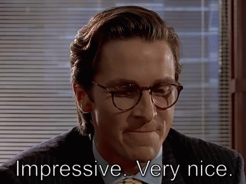 A Man Wearing Glasses And A Suit Has The Words Impressive Very Nice Written Below Him GIF
