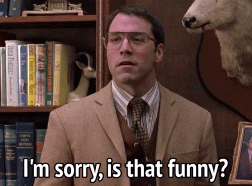 A Man Wearing Glasses And A Suit Says I 'M Sorry Is That Funny GIF