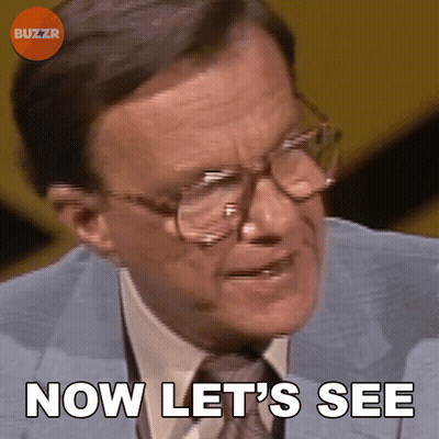 A Man Wearing Glasses And A Suit Says Now Let 'S See GIF