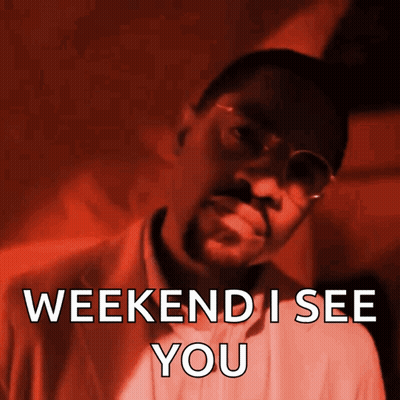 A Man Wearing Glasses And A Suit Says " Weekend I See You " GIF