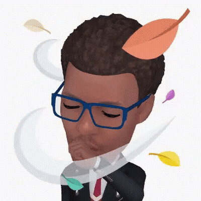 A Man Wearing Glasses And A Suit With Leaves Coming Out Of His Head GIF