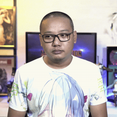 A Man Wearing Glasses And A T-Shirt With A Girl 'S Face On It GIF