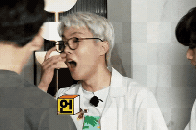 A Man Wearing Glasses And A T-Shirt With A Palm Tree On It Is Making A Funny Face GIF