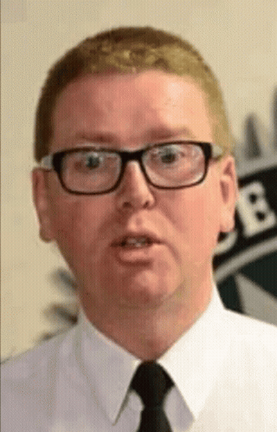 A Man Wearing Glasses And A Tie Is Talking GIF