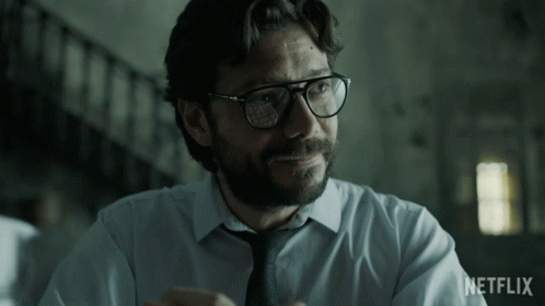 A Man Wearing Glasses And A Tie With The Word Netflix On The Bottom Right GIF